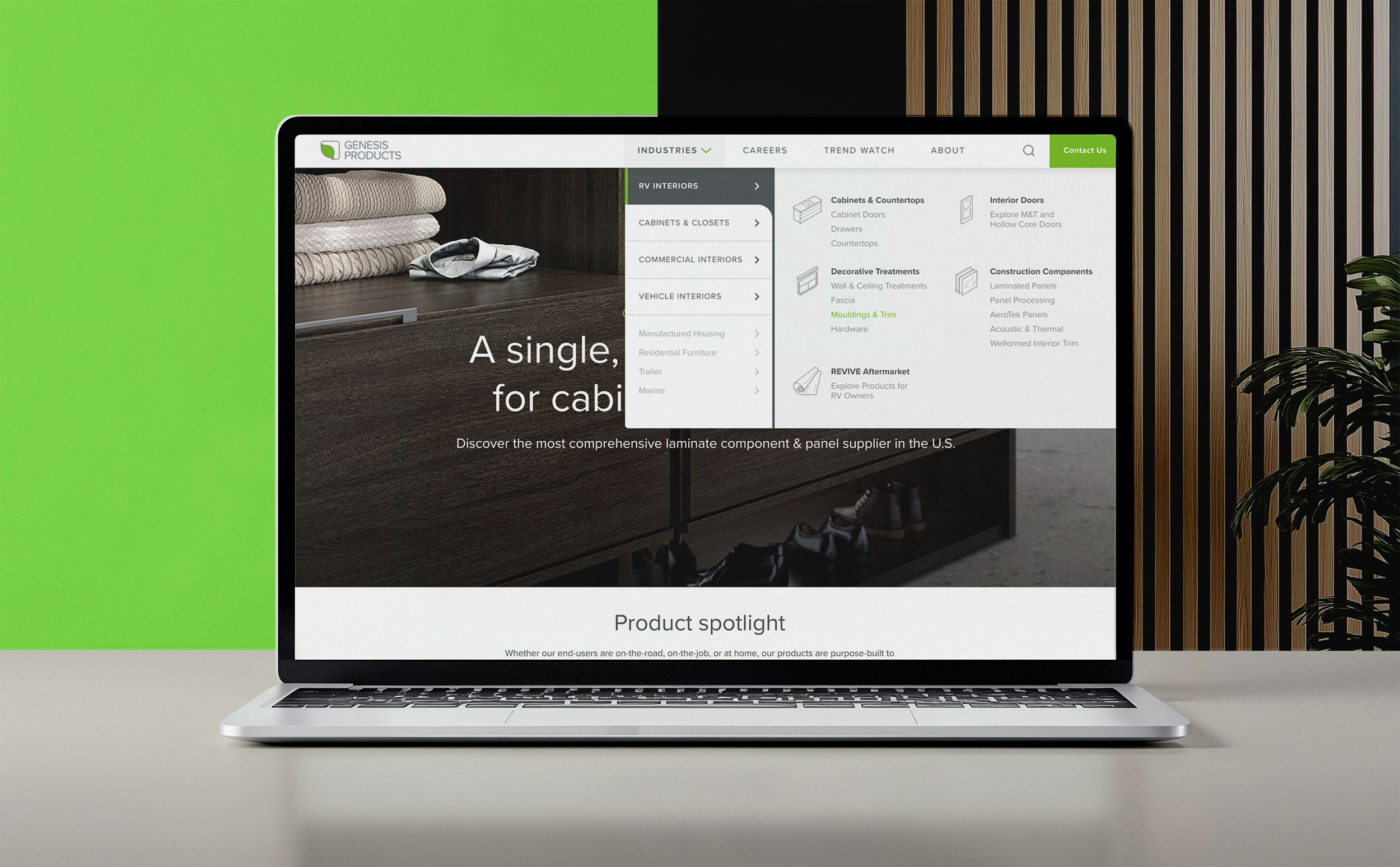 Laptop mockup of the desktop Industries mega-menu showing RV Interiors categories